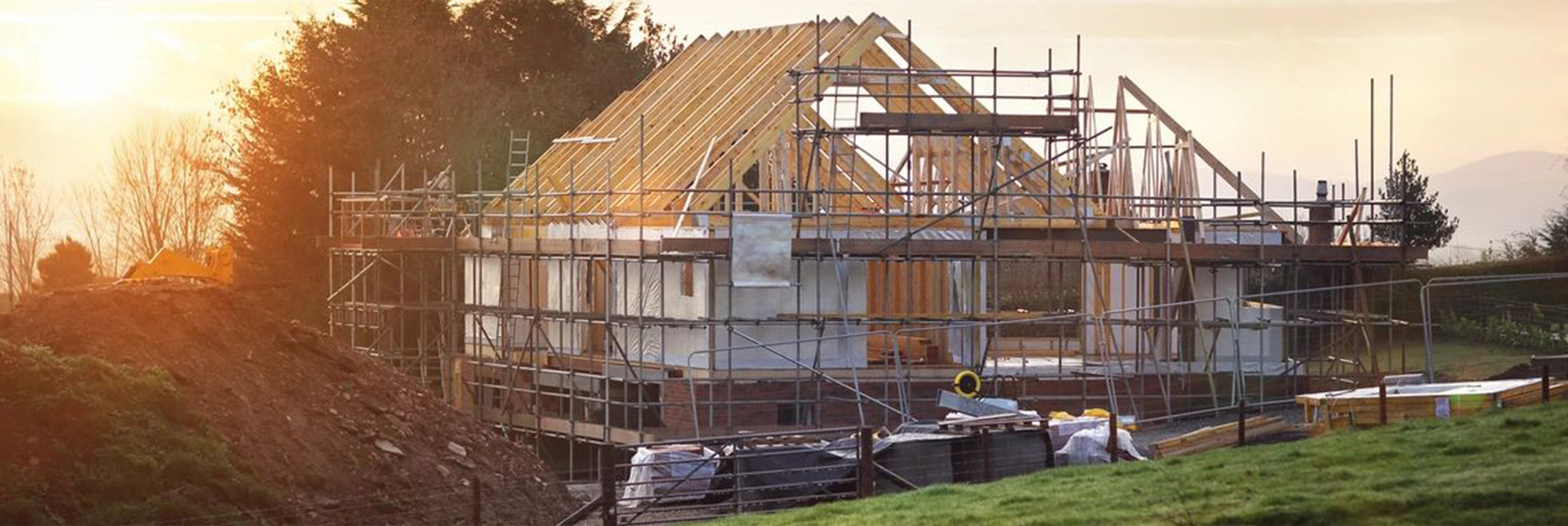 Brick residential building under construction with scaffolding